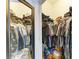 Walk-in closet for organizing clothes and shoes at 16934 Oval Rum Dr, Wimauma, FL 33598