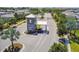 A gated community entrance with a guardhouse, showcasing lush landscaping and controlled access at 16934 Oval Rum Dr, Wimauma, FL 33598