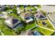 Aerial backyard showcasing well-maintained lawn, fenced yard, patio, trampoline, and pool in neighborhood at 18734 Burndall Ct, Land O Lakes, FL 34638