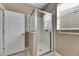 Bathroom featuring a glass shower enclosure and neutral-toned walls at 18734 Burndall Ct, Land O Lakes, FL 34638