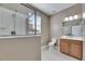 Well-lit bathroom featuring a glass-enclosed shower and a vanity with storage at 18734 Burndall Ct, Land O Lakes, FL 34638