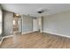 Spacious bedroom featuring wood-look floors and a connecting bathroom with a luxurious tub at 18734 Burndall Ct, Land O Lakes, FL 34638