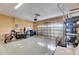 Spacious garage with epoxy flooring, ample storage, and secure roll-up door at 18734 Burndall Ct, Land O Lakes, FL 34638