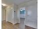 Hallway with laminate floors and view to bedroom at 18734 Burndall Ct, Land O Lakes, FL 34638
