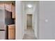 Bright hallway leading to bedrooms with ample closet space and tile flooring at 18734 Burndall Ct, Land O Lakes, FL 34638