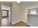 Hallway features wood floors, neutral paint, and view of adjacent rooms at 18734 Burndall Ct, Land O Lakes, FL 34638