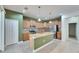 Well-equipped kitchen with a center island, tile backsplash, and stainless steel appliances at 18734 Burndall Ct, Land O Lakes, FL 34638