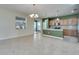 Open concept kitchen with stainless steel appliances and eat-in dining area featuring decorative chandelier at 18734 Burndall Ct, Land O Lakes, FL 34638