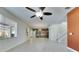 Open concept living area with tile flooring and kitchen with wood cabinets at 18734 Burndall Ct, Land O Lakes, FL 34638
