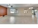 Expansive living room showcasing tile flooring and abundant natural light from multiple windows at 18734 Burndall Ct, Land O Lakes, FL 34638