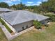 An aerial view of the community shows well-maintained landscaping, manicured lawns, and thoughtful layout at 1901 Canterbury Ln # 14, Sun City Center, FL 33573