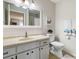 Clean bathroom featuring a vanity with ample storage, neutral countertops, and coordinated accessories at 1901 Canterbury Ln # 14, Sun City Center, FL 33573