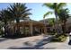 Elegant porte cochere entrance with meticulously maintained landscaping and brick-paved driveway at 1901 Canterbury Ln # 14, Sun City Center, FL 33573