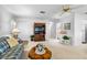 Spacious living room with a ceiling fan and classic wooden furniture at 1901 Canterbury Ln # 14, Sun City Center, FL 33573