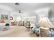 Bright living room with large windows and comfortable seating area at 1901 Canterbury Ln # 14, Sun City Center, FL 33573