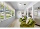 Cozy sunroom featuring comfortable seating and ample natural light at 1901 Canterbury Ln # 14, Sun City Center, FL 33573