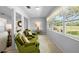 Bright sunroom with large windows offering scenic outdoor views at 1901 Canterbury Ln # 14, Sun City Center, FL 33573