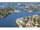 Stunning aerial view of waterfront homes, showcasing the idyllic coastal community and serene waterways at 200 Meres Blvd # 7, Tarpon Springs, FL 34689