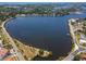 Expansive aerial view of a stunning waterfront community and serene lake at 200 Meres Blvd # 7, Tarpon Springs, FL 34689