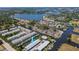 An aerial view of a waterfront townhome community, showcasing water access, and proximity to the community waterways at 200 Meres Blvd # 7, Tarpon Springs, FL 34689