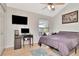 Cozy bedroom with a computer setup and a view of the outdoors at 200 Meres Blvd # 7, Tarpon Springs, FL 34689