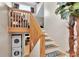 Carpeted staircase leading to the loft area with stacked washer/dryer at 200 Meres Blvd # 7, Tarpon Springs, FL 34689