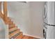 Staircase leading to upper level, conveniently located near laundry appliances at 200 Meres Blvd # 7, Tarpon Springs, FL 34689
