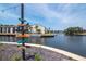 Scenic waterfront view with a nautical sign, boats, and lush surroundings at 200 Meres Blvd # 7, Tarpon Springs, FL 34689