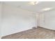 Neutral bedroom with vinyl floor, closet, and natural light at 2001 Spooner Dr, Plant City, FL 33563