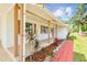 Charming home showcases a well-manicured lawn and a beautifully landscaped entryway, with a covered porch at 2001 Spooner Dr, Plant City, FL 33563