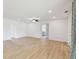 Spacious open-concept area featuring wood floors and recessed lighting, creating a bright and modern space at 2001 Spooner Dr, Plant City, FL 33563
