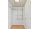 Bright walk-in closet features wire shelves and neutral vinyl floor at 2001 Spooner Dr, Plant City, FL 33563