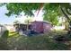 Backyard with patio, seating, and partial shade cover at 2087 59Th N St, Clearwater, FL 33760