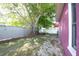 Large tree with mature landscaping in fenced backyard at 2087 59Th N St, Clearwater, FL 33760