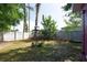 Spacious backyard with a well-maintained lawn, bordered by a privacy fence, ideal for outdoor activities at 2087 59Th N St, Clearwater, FL 33760