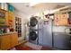 Functional garage space equipped with appliances, storage cabinets, and laundry facilities at 2087 59Th N St, Clearwater, FL 33760
