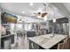 Open-concept kitchen featuring granite counters, stainless appliances, breakfast bar and seamless flow at 2087 59Th N St, Clearwater, FL 33760