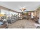 Cozy living room featuring a stone fireplace, comfortable seating, and neutral decor at 2087 59Th N St, Clearwater, FL 33760