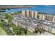 Aerial view of community highlighting buildings, parking, and beautiful waterfront views at 2614 Cove Cay Dr # 301, Clearwater, FL 33760
