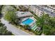 Drone view capturing pool, hot tub, shuffleboard and outdoor seating within the property at 2614 Cove Cay Dr # 301, Clearwater, FL 33760