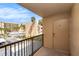 A balcony overlooking the street with a view of palm trees and nearby buildings at 2614 Cove Cay Dr # 301, Clearwater, FL 33760