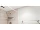 Updated bathroom showcasing tiled shower with modern fixtures and a convenient towel rack at 2614 Cove Cay Dr # 301, Clearwater, FL 33760