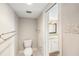 Comfortable half bathroom with ceramic tiling adjacent to the main bathroom and bedroom at 2614 Cove Cay Dr # 301, Clearwater, FL 33760