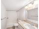 Well-lit bathroom with shower/tub, single sink vanity and stone counter top at 2614 Cove Cay Dr # 301, Clearwater, FL 33760