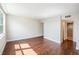 This bedroom features beautiful wood floors, closet access and natural light at 2614 Cove Cay Dr # 301, Clearwater, FL 33760