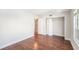 This bedroom features wood floors, closet space and an en suite bathroom at 2614 Cove Cay Dr # 301, Clearwater, FL 33760