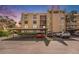 Exterior view of building with covered parking and surrounding landscaping at 2614 Cove Cay Dr # 301, Clearwater, FL 33760