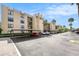 Low angle exterior shot of a condominium building with a parking area at 2614 Cove Cay Dr # 301, Clearwater, FL 33760