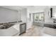 Bright kitchen features stainless steel appliances, tiled backsplash, and natural light at 2614 Cove Cay Dr # 301, Clearwater, FL 33760