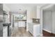 Updated kitchen featuring white cabinets, stainless appliances, and tile backsplash at 2614 Cove Cay Dr # 301, Clearwater, FL 33760